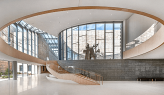 The Phillip G. Schrager Atrium with large wooden staricase created by RCS.